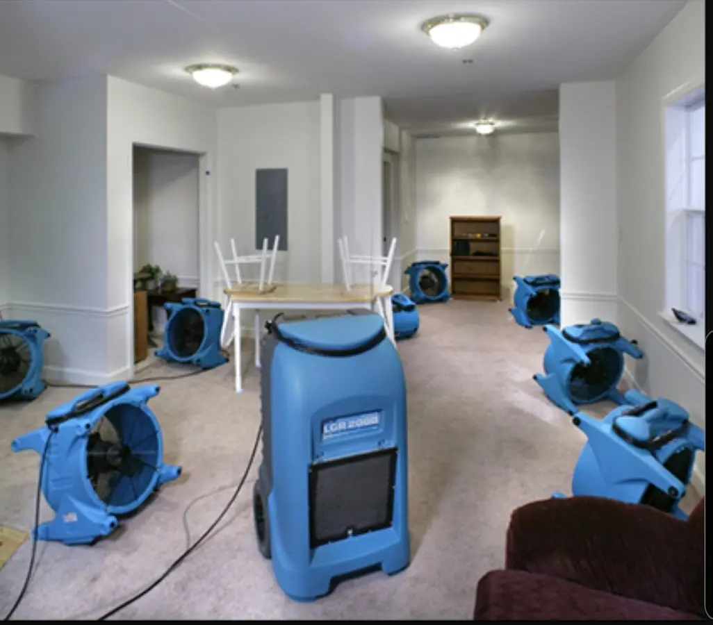 Air movers and dehumidifier setup for Water Damage Restoration in Groveland